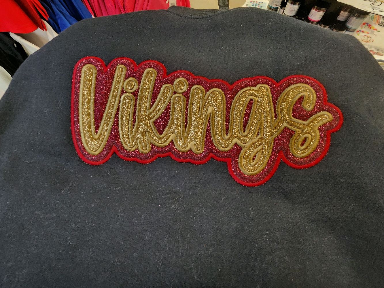"Vikings" Gold Glitter Offset in Burgundy Glitter Embroidered Sweatshirt Double Layer Glitter Script